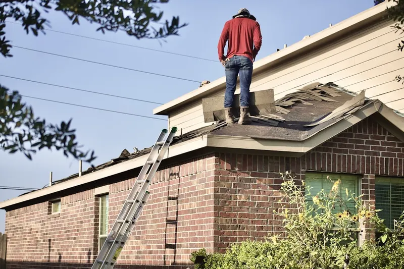 Professional roofer working on a residential roof in Ridgecrest